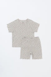 Front view of Avauma Mellow Days Set in Berry Cream, short-sleeve baby summer pajama set laid flat